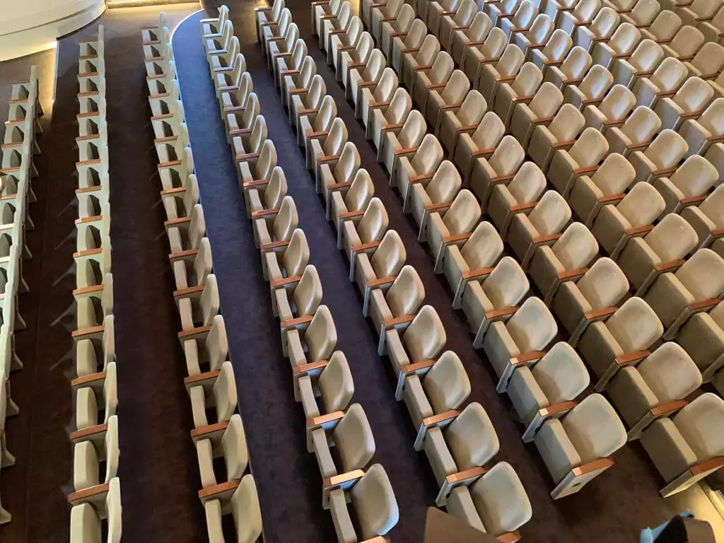 VIP conference seats with adjustable armrests and lumbar support installed in this high-end auditorium. Image